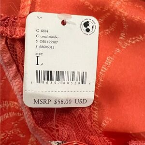 Free People Intimately shades of orange print floral camisole . 100% polyester.